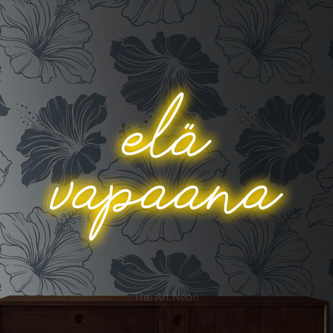 LED neon sign reading “elä vapaana”, arranged in 2 lines.