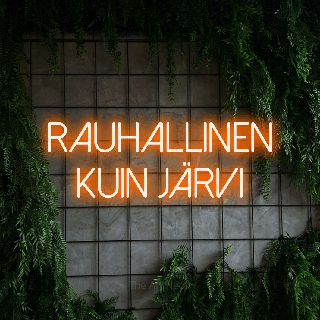 LED neon sign reading “RAUHALLINEN KUIN JÄRVI”, arranged in 2 lines.