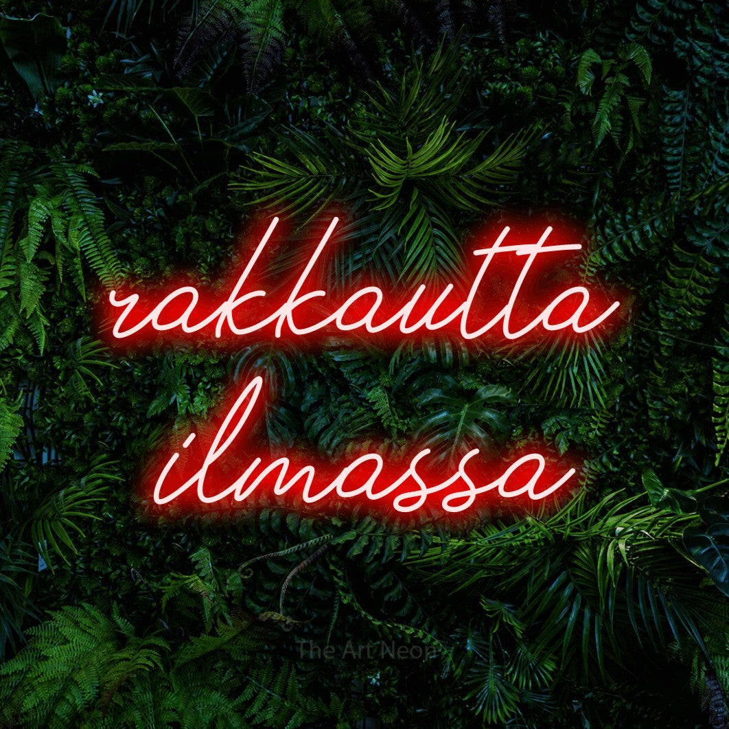 LED neon sign reading “rakkautta ilmassa”, arranged in 2 lines.