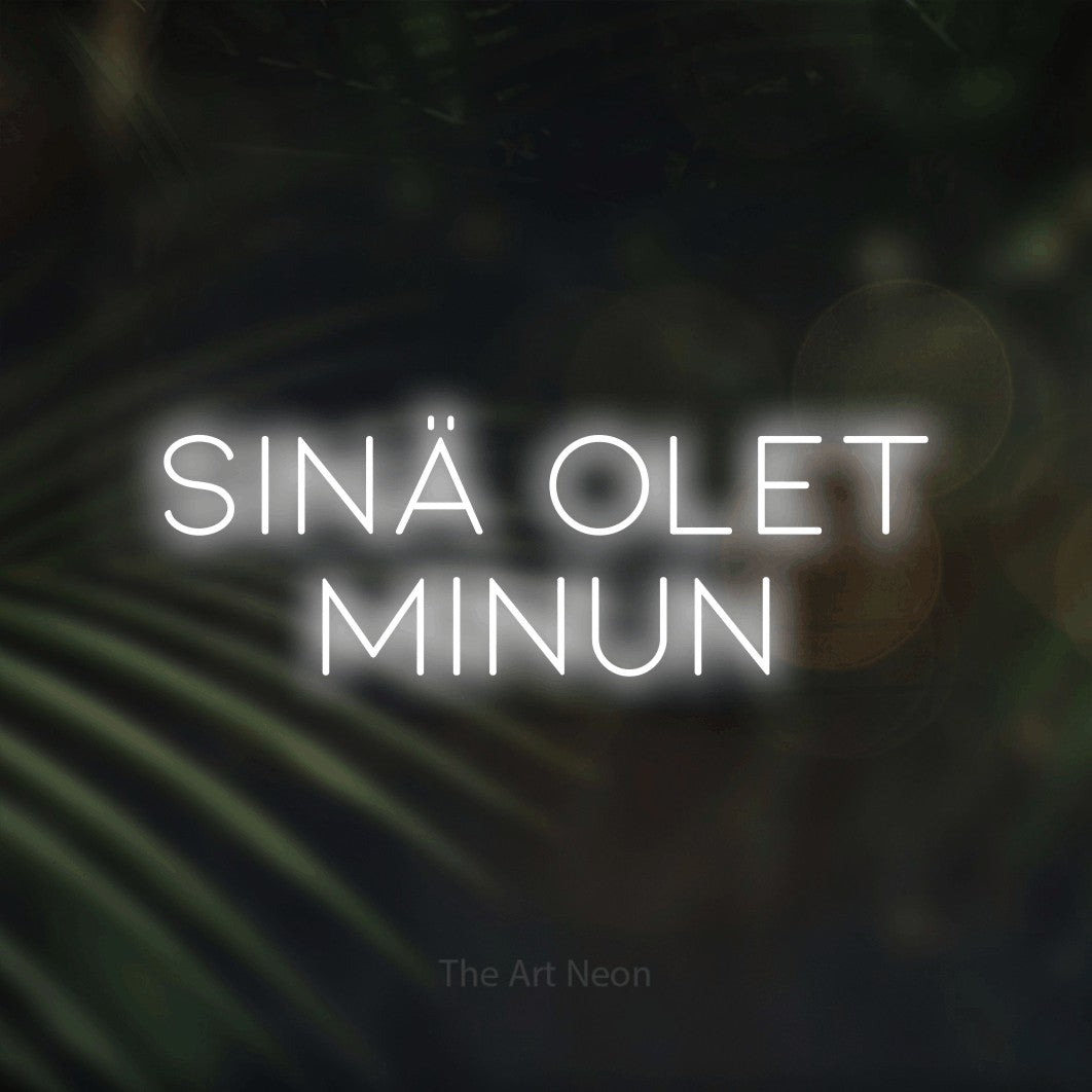 LED neon sign reading “SINÄ OLET MINUN”, arranged in 2 lines.