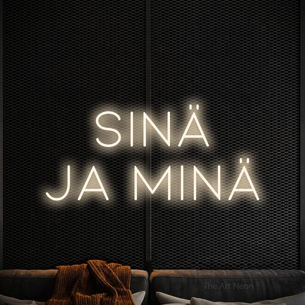 LED neon sign reading “SINÄ JA MINÄ”, arranged in 2 lines.