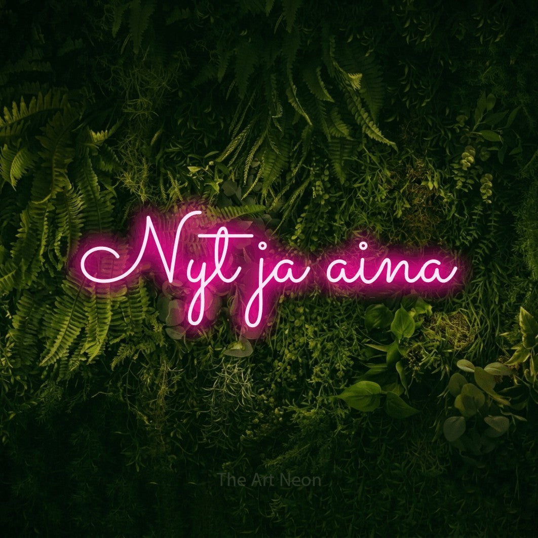 LED neon sign reading “Nyt ja aina”, arranged in a single line.