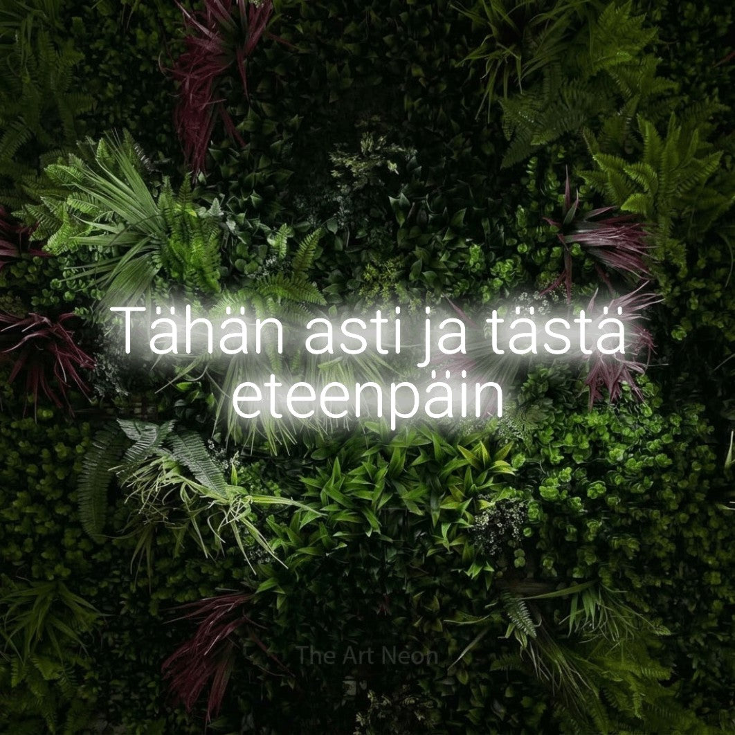LED neon sign reading “Tähän asti ja tästä eteenpäin”, arranged in 2 lines.