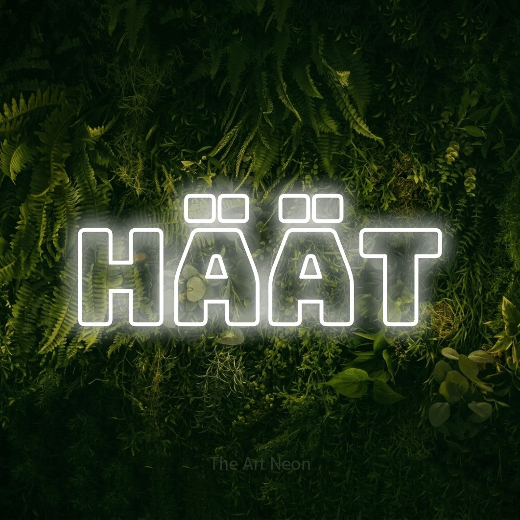 LED neon sign reading “Häät”, arranged in a single line.