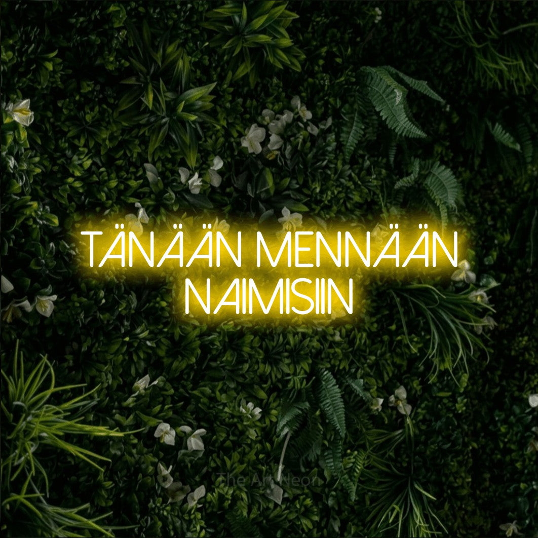 LED neon sign reading “Tänään mennään naimisiin”, arranged in 2 lines.