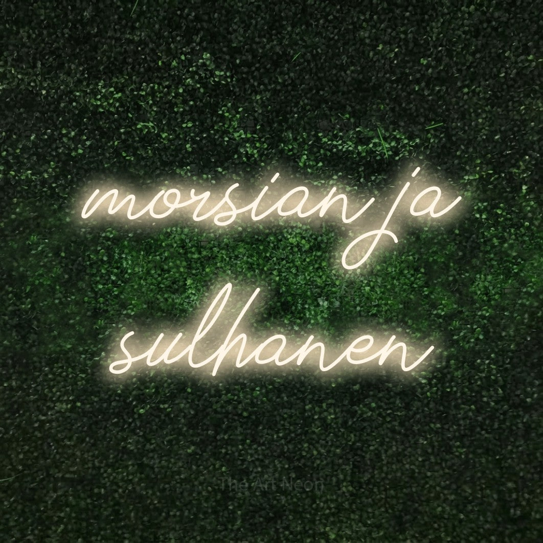 LED neon sign reading “morsian ja sulhanen”, arranged in 2 lines.