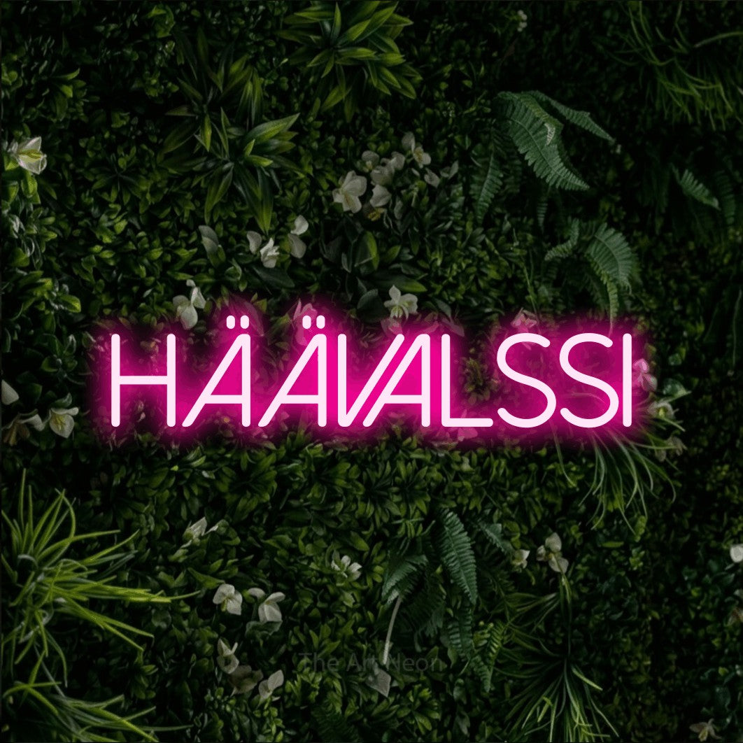 LED neon sign reading “HÄÄVALSSI”, arranged in a single line.