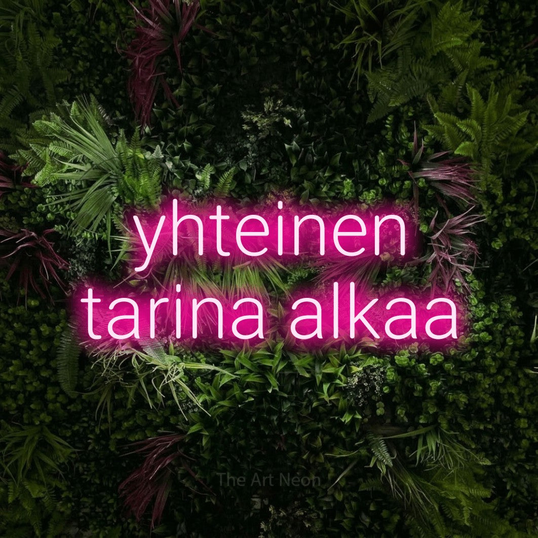 LED neon sign reading “yhteinen tarina alkaa”, arranged in 2 lines.