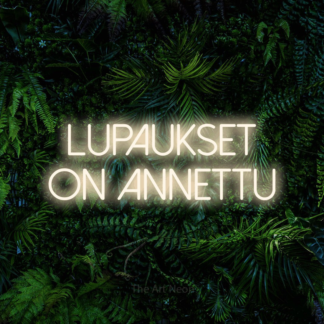 LED neon sign reading “LUPAUKSET ON ANNETTU”, arranged in 2 lines.