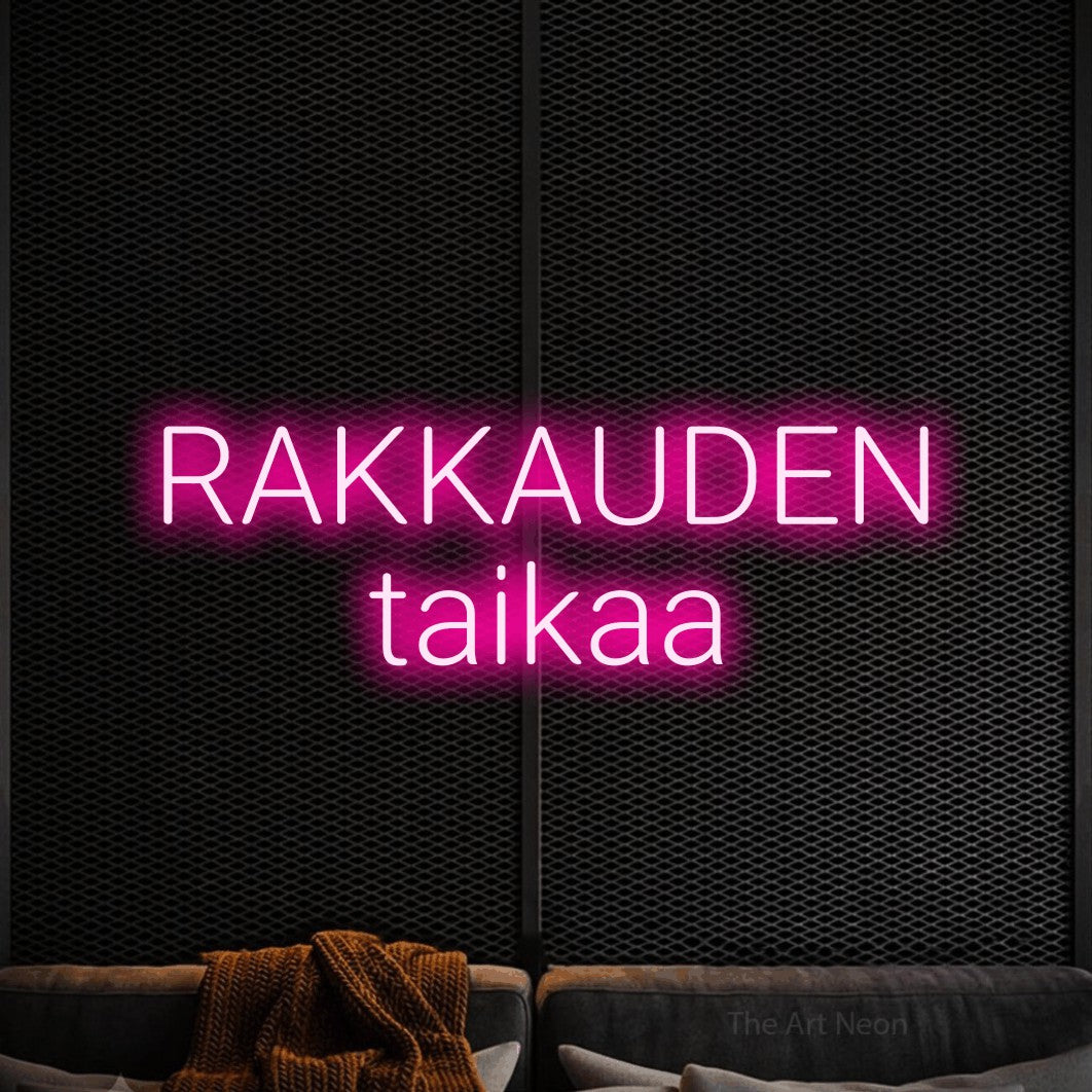 LED neon sign reading “RAKKAUDEN taikaa”, arranged in 2 lines.
