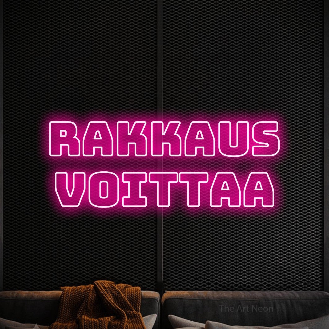 LED neon sign reading “Rakkaus voittaa”, arranged in 2 lines.