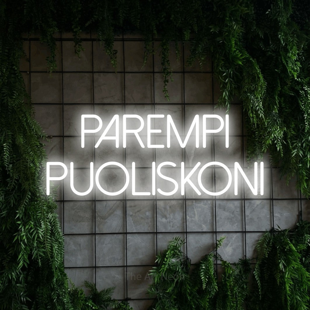 LED neon sign reading “Parempi puoliskoni”, arranged in 2 lines.
