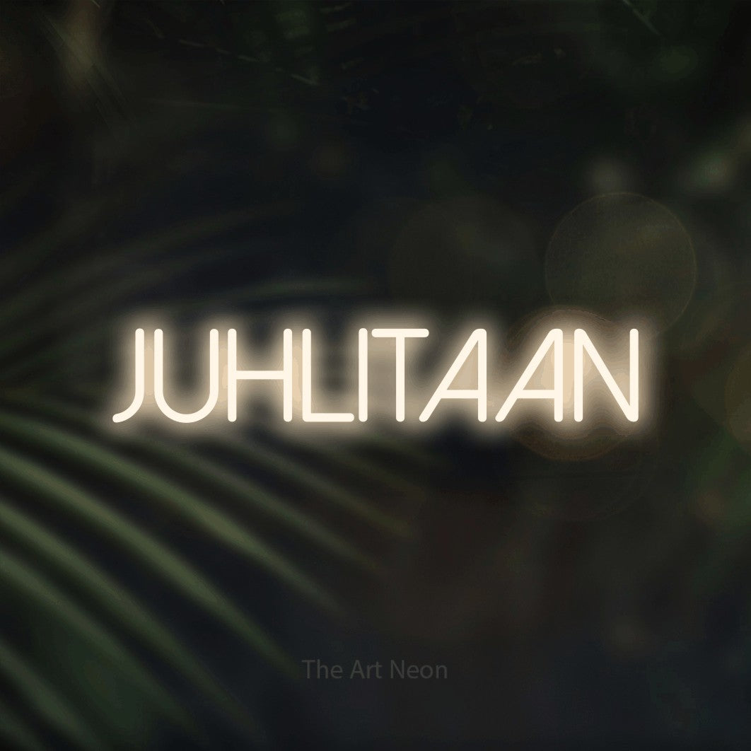 LED neon sign reading “JUHLITAAN”, arranged in a single line.
