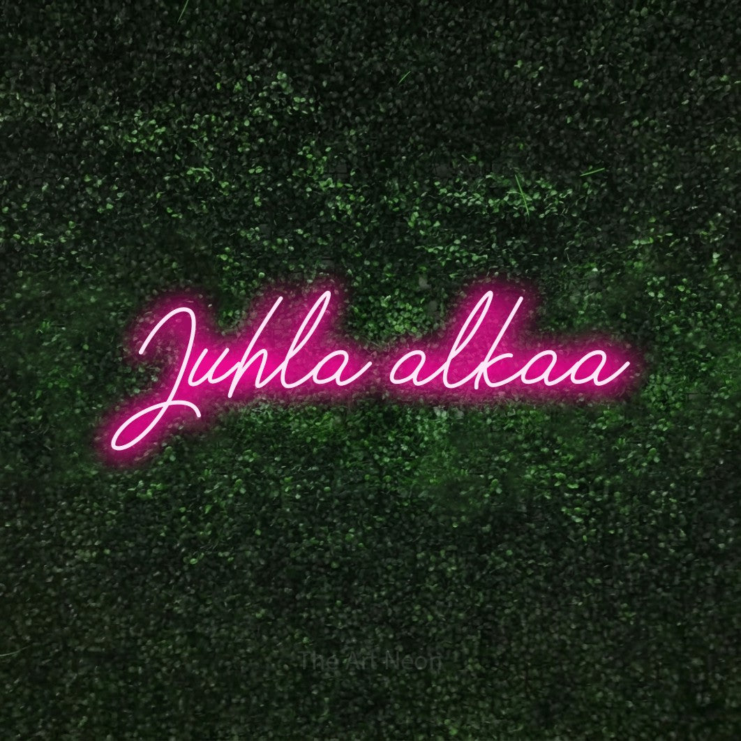 LED neon sign reading “Juhla alkaa”, arranged in a single line.