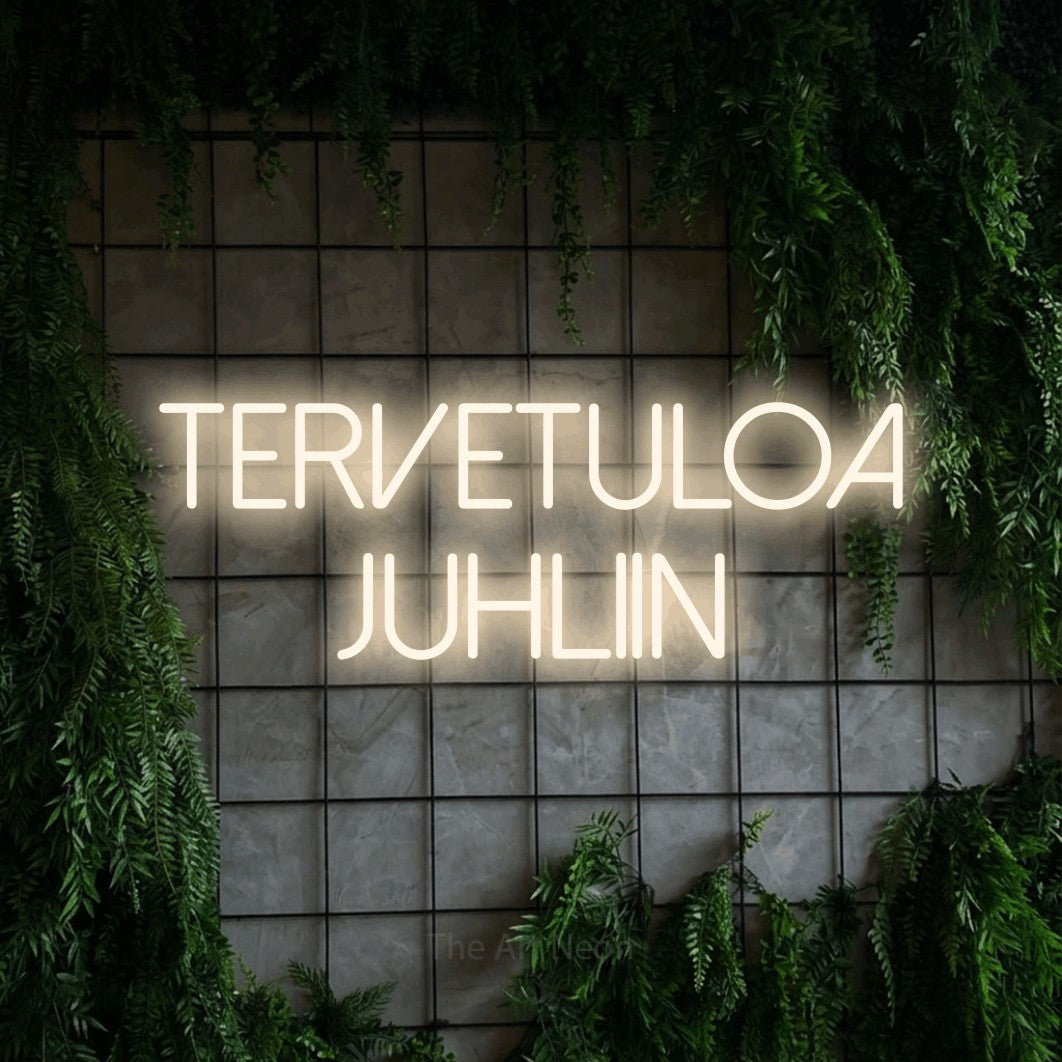 LED neon sign reading “Tervetuloa juhliin”, arranged in 2 lines.