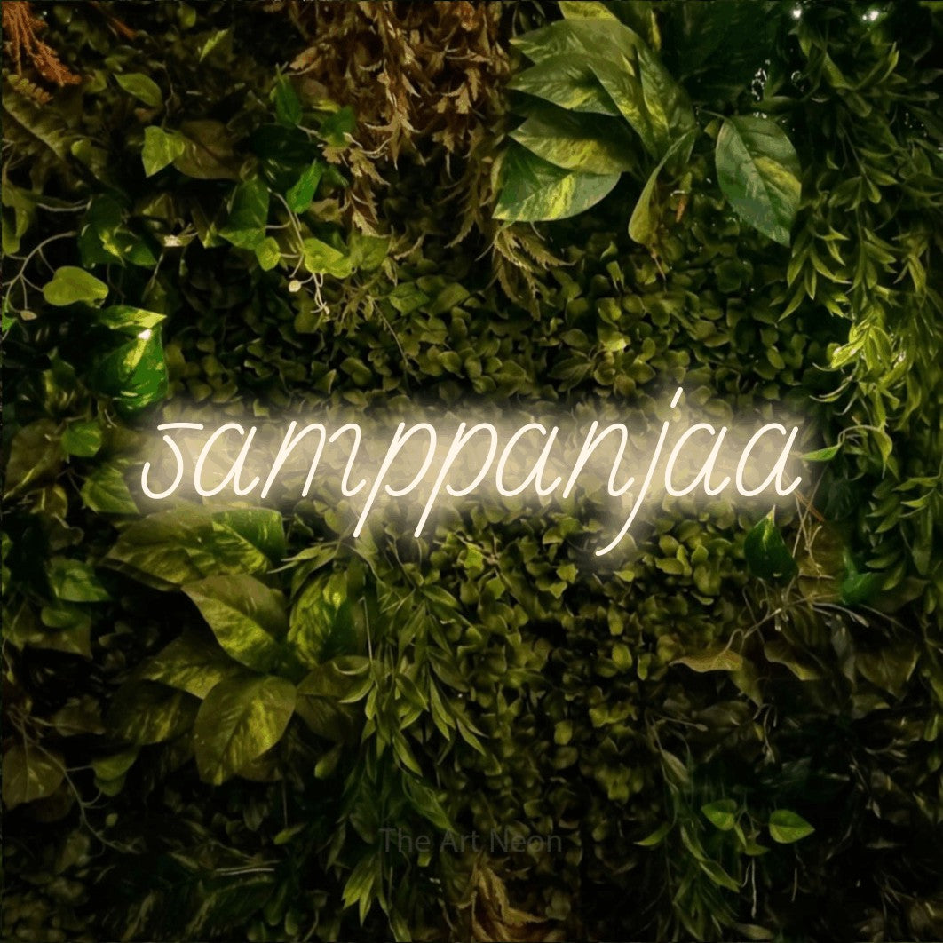 LED neon sign reading “samppanjaa”, arranged in a single line.