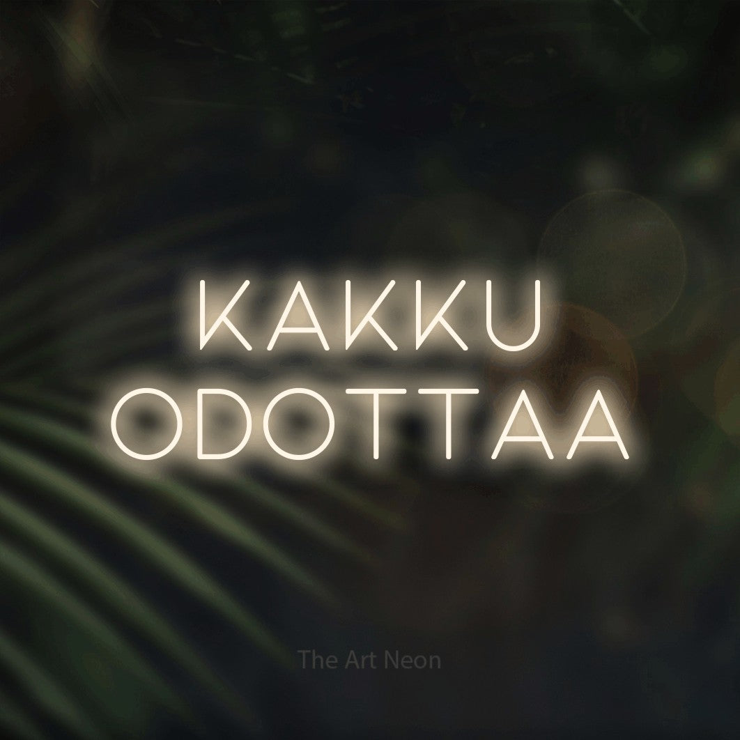 LED neon sign reading “Kakku odottaa”, arranged in 2 lines.