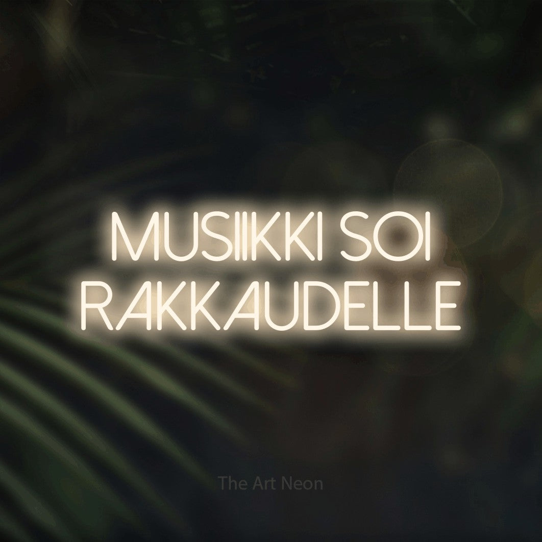 LED neon sign reading “Musiikki soi rakkaudelle”, arranged in 2 lines.
