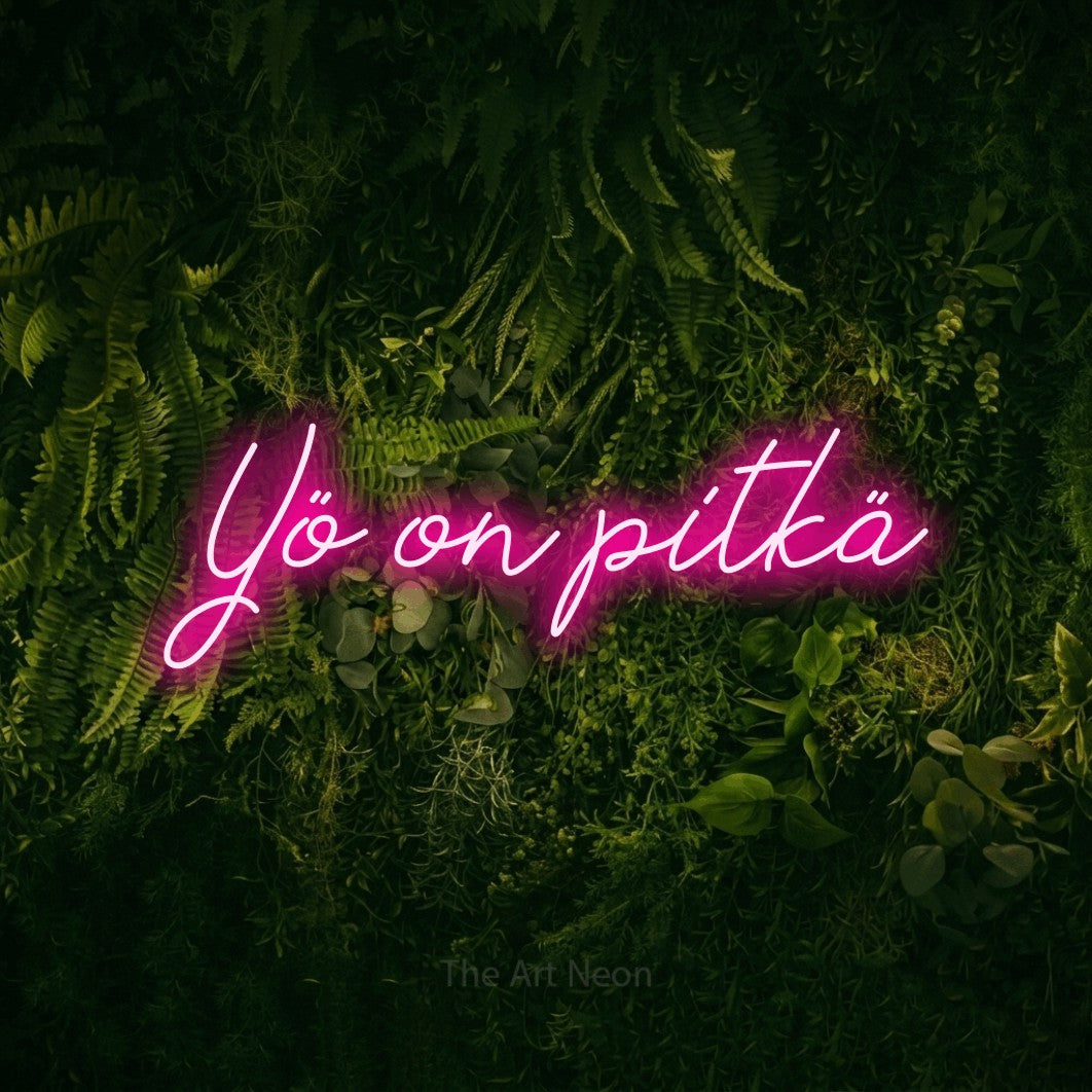 LED neon sign reading “Yö on pitkä”, arranged in a single line.