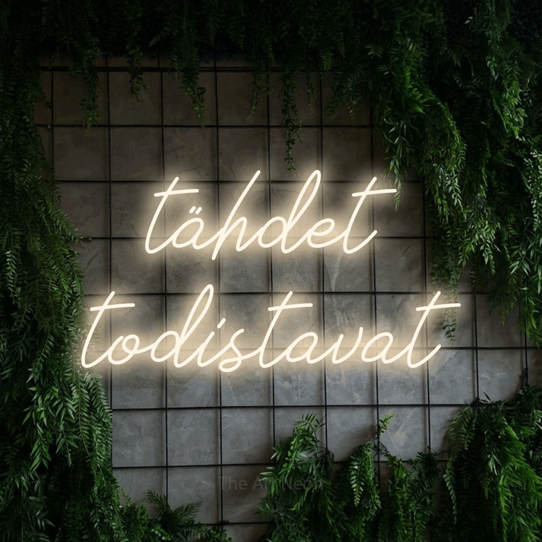 LED neon sign reading “tähdet todistavat”, arranged in 2 lines.