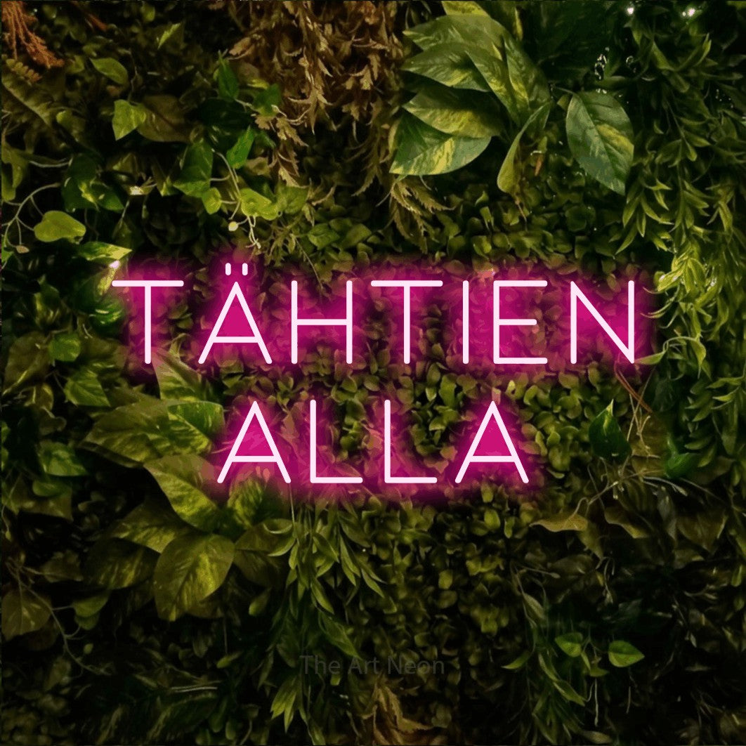 LED neon sign reading “Tähtien alla”, arranged in 2 lines.