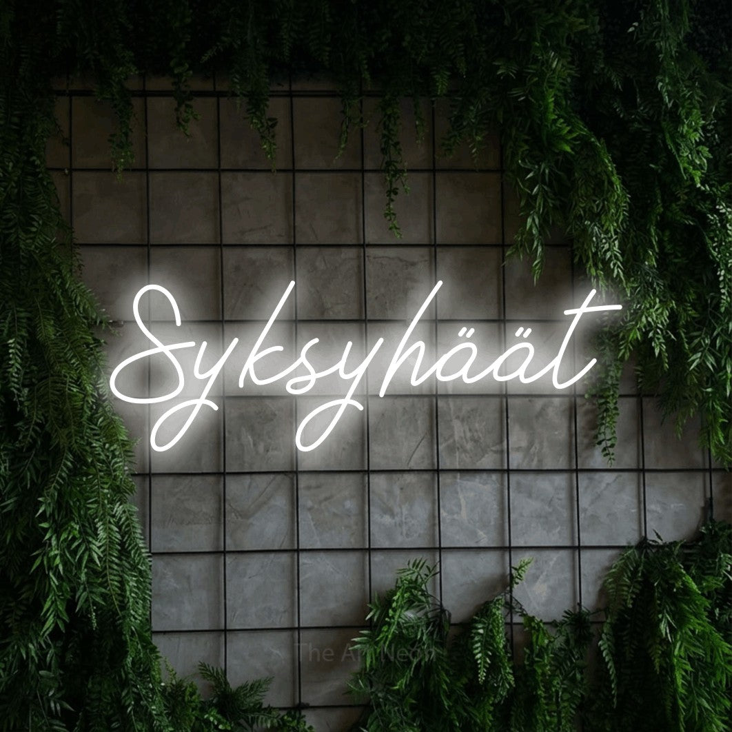 LED neon sign reading “Syksyhäät”, arranged in a single line.