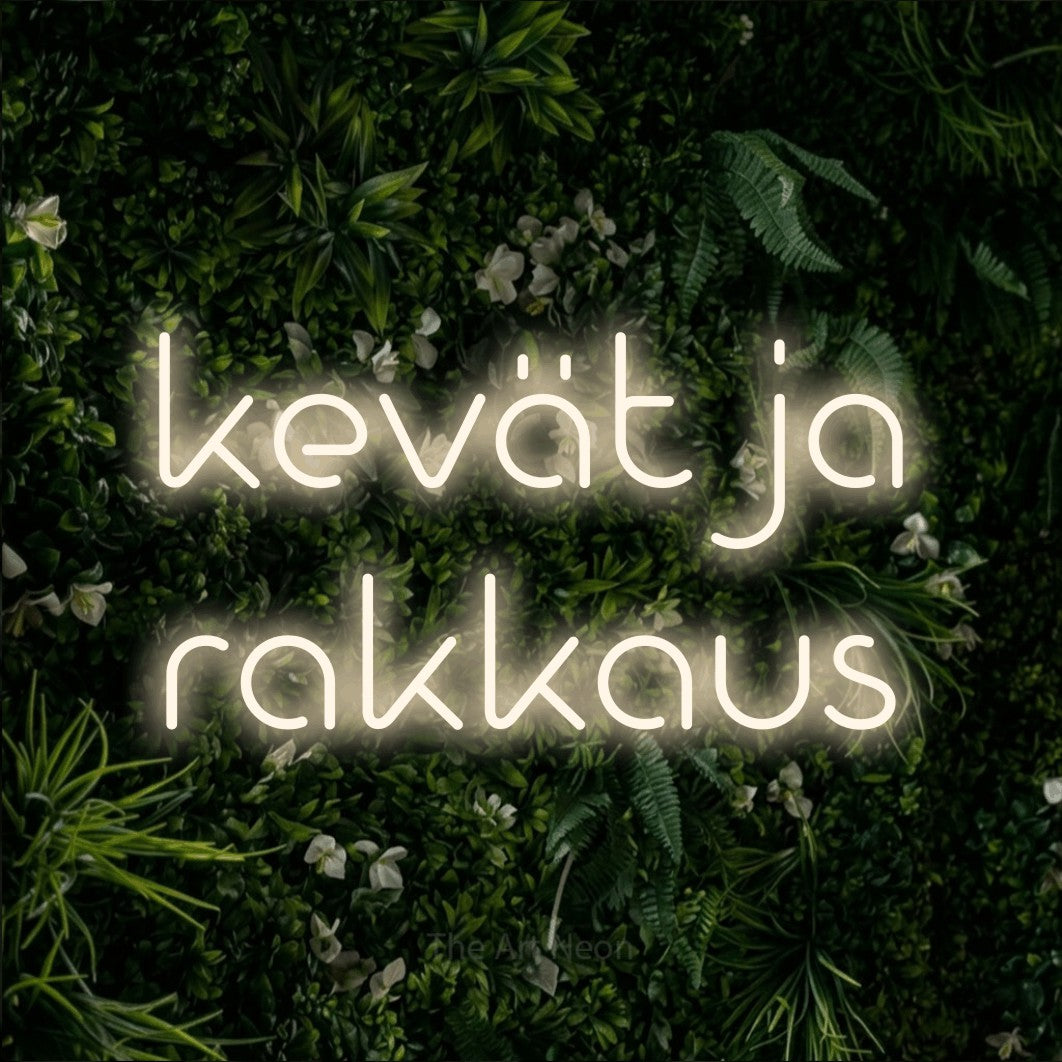 LED neon sign reading “kevät ja rakkaus”, arranged in 2 lines.
