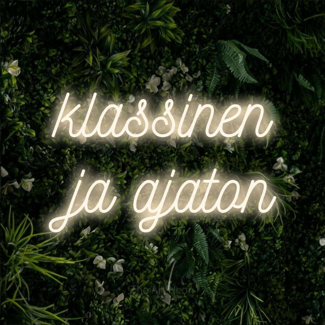 LED neon sign reading “klassinen ja ajaton”, arranged in 2 lines.