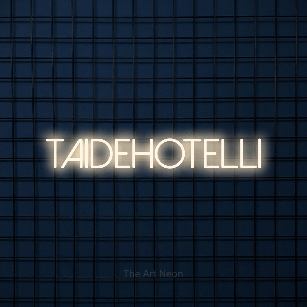 LED neon sign reading “Taidehotelli”, arranged in a single line.
