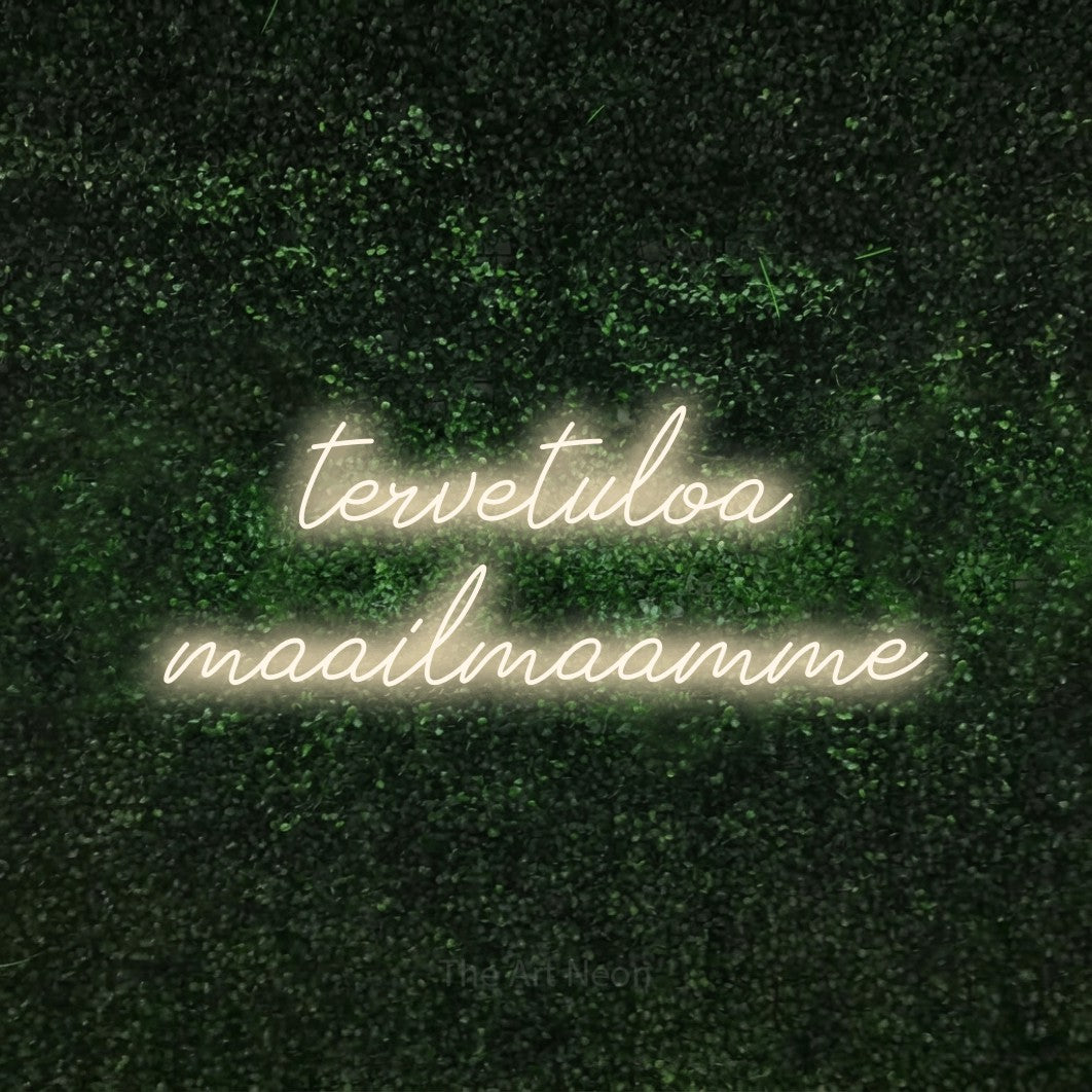 LED neon sign reading “tervetuloa maailmaamme”, arranged in 2 lines.