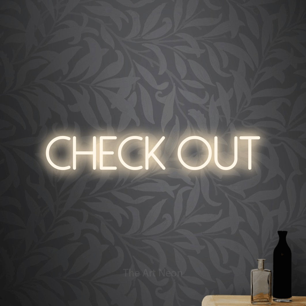 LED neon sign reading “Check out”, arranged in a single line.