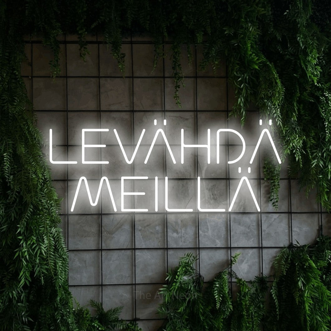 LED neon sign reading “LEVÄHDÄ MEILLÄ”, arranged in 2 lines.