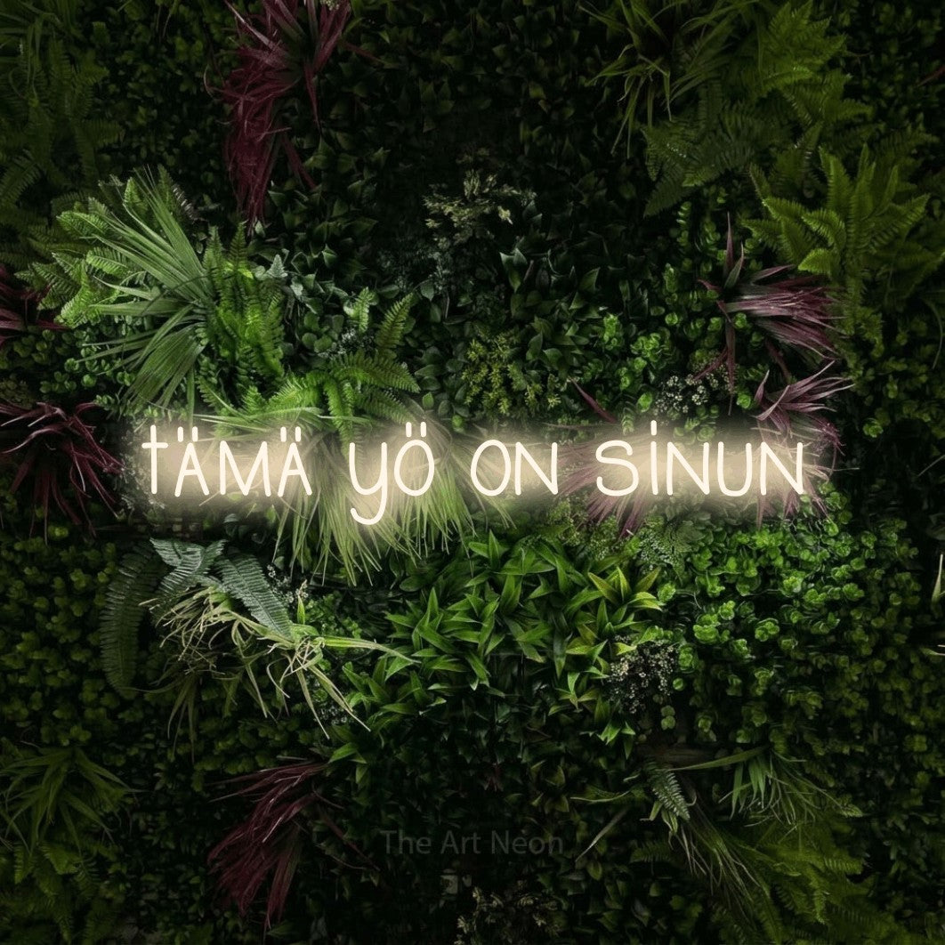 LED neon sign reading “tämä yö on sinun”, arranged in a single line.