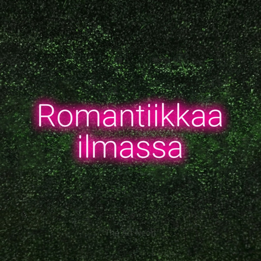 LED neon sign reading “Romantiikkaa ilmassa”, arranged in 2 lines.