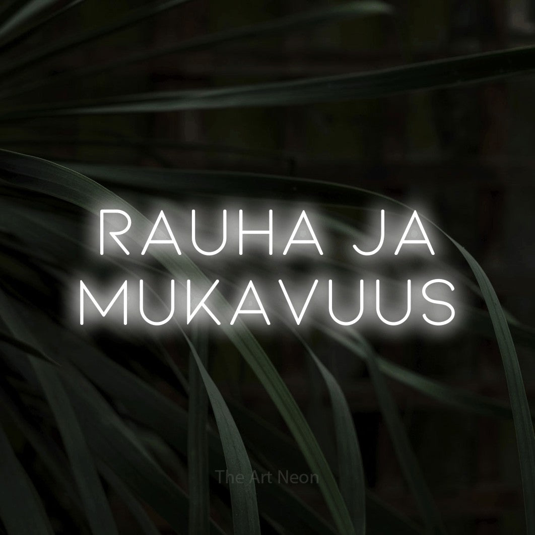 LED neon sign reading “Rauha ja mukavuus”, arranged in 2 lines.