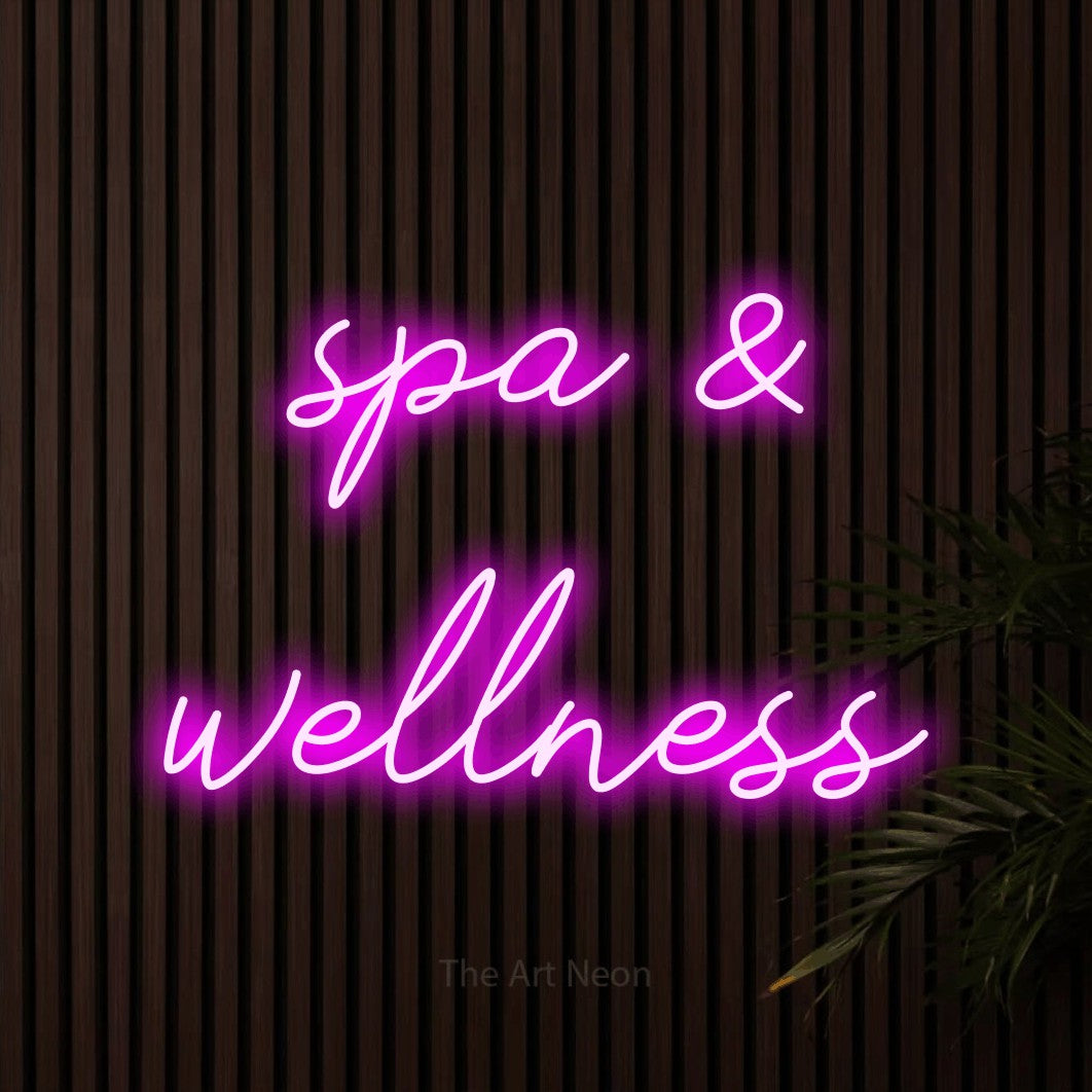LED neon sign reading “spa & wellness”, arranged in 2 lines.