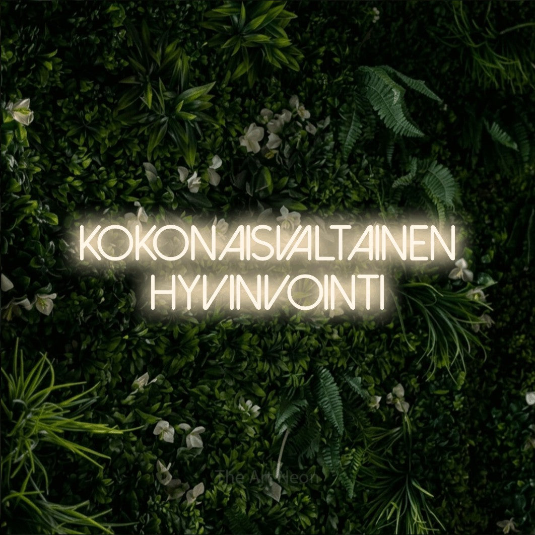LED neon sign reading “Kokonaisvaltainen hyvinvointi”, arranged in 2 lines.