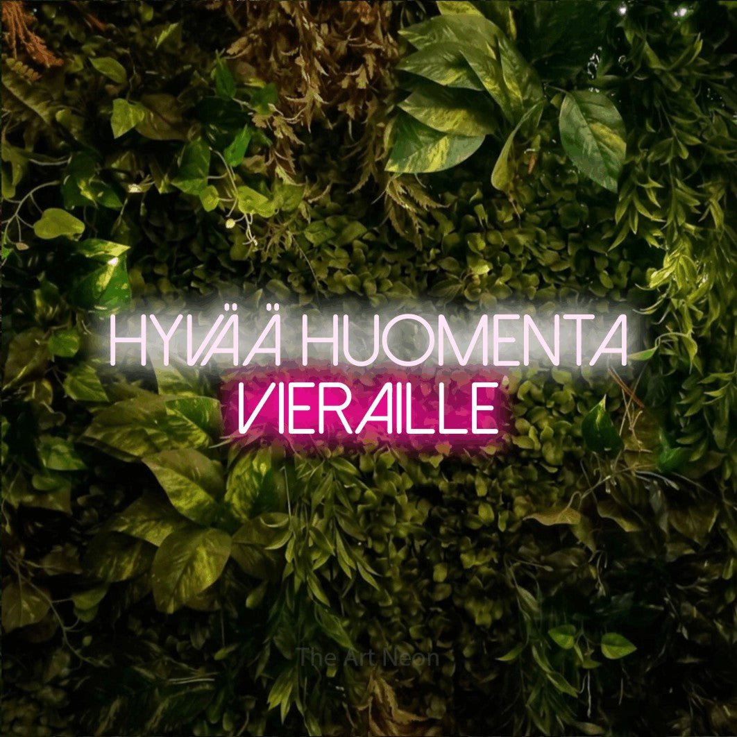LED neon sign reading “hyvää huomenta vieraille”, arranged in 2 lines.