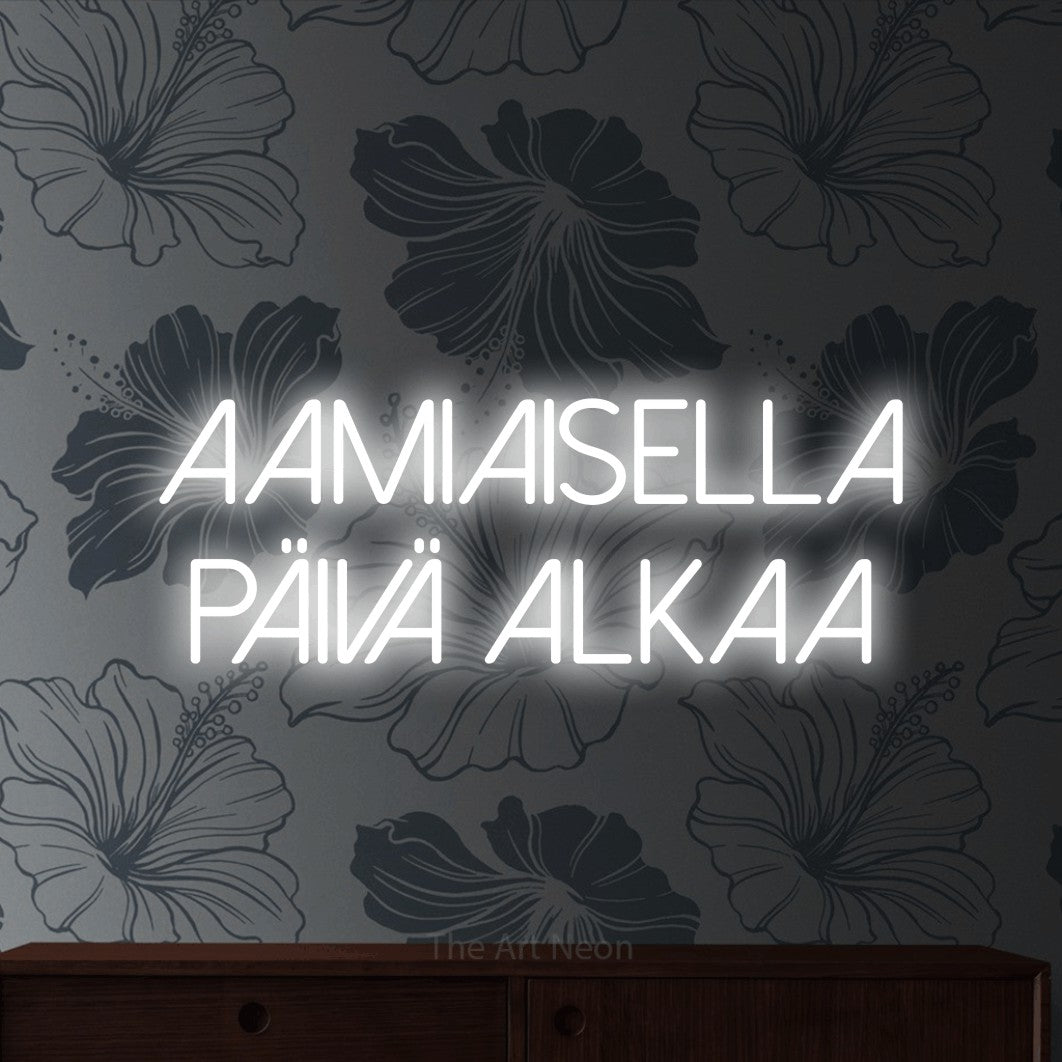 LED neon sign reading “AAMIAISELLA PÄIVÄ ALKAA”, arranged in 2 lines.