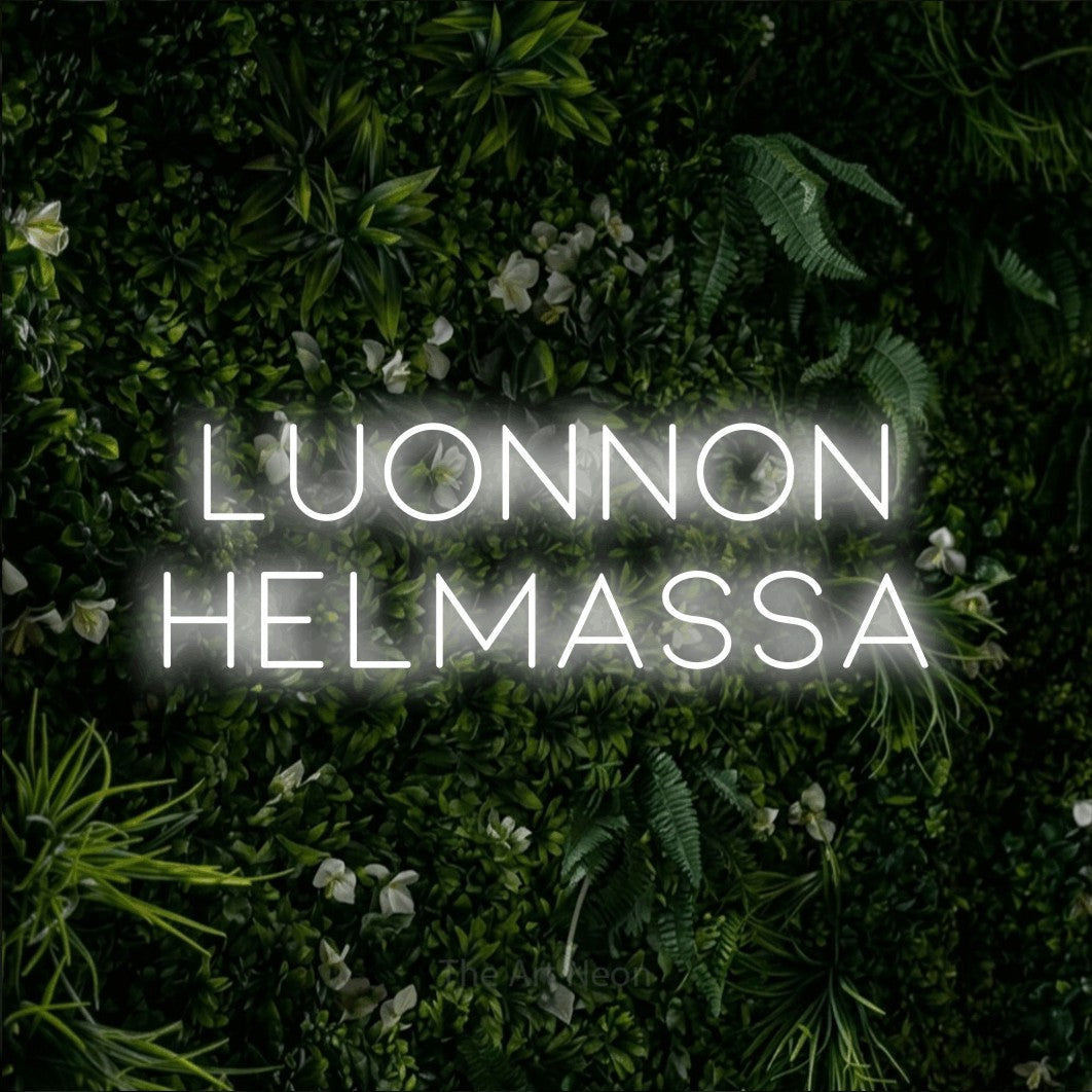 LED neon sign reading “luonnon HELMASSA”, arranged in 2 lines.