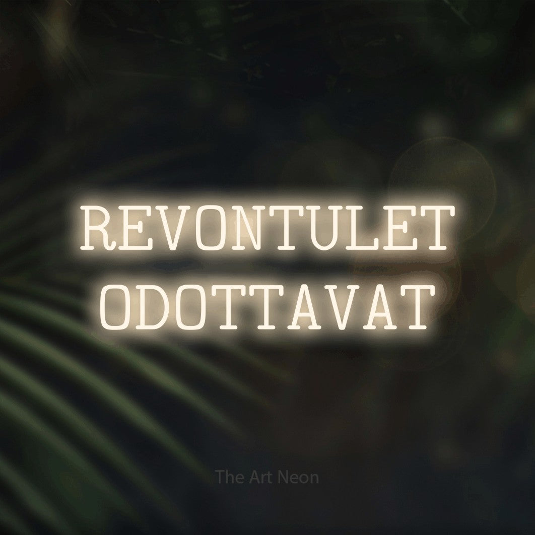 LED neon sign reading “REVONTULET ODOTTAVAT”, arranged in 2 lines.