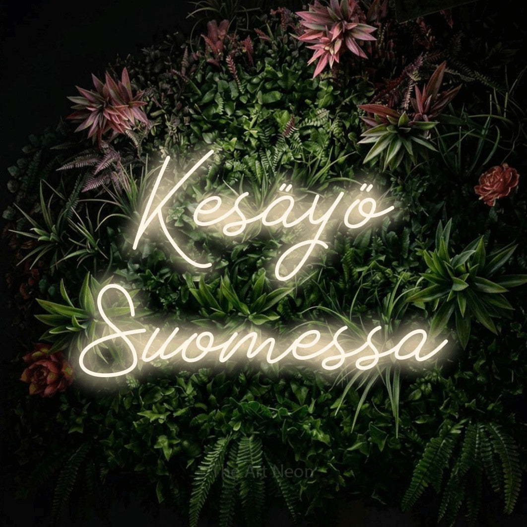 LED neon sign reading “Kesäyö Suomessa”, arranged in 2 lines.