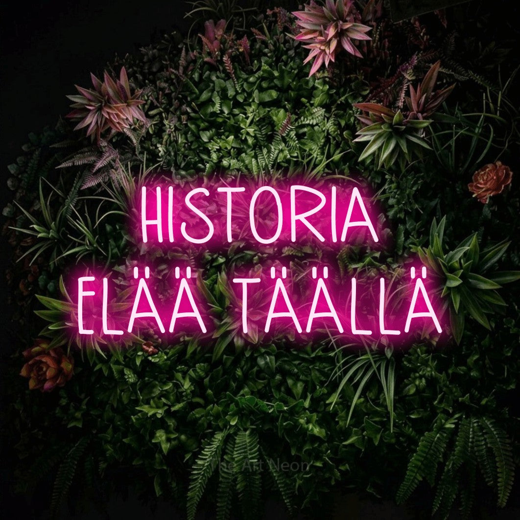 LED neon sign reading “HISTORIA ELÄÄ TÄÄLLÄ”, arranged in 2 lines.
