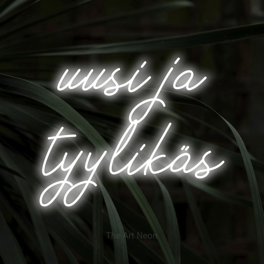 LED neon sign reading “uusi ja tyylikäs”, arranged in 2 lines.