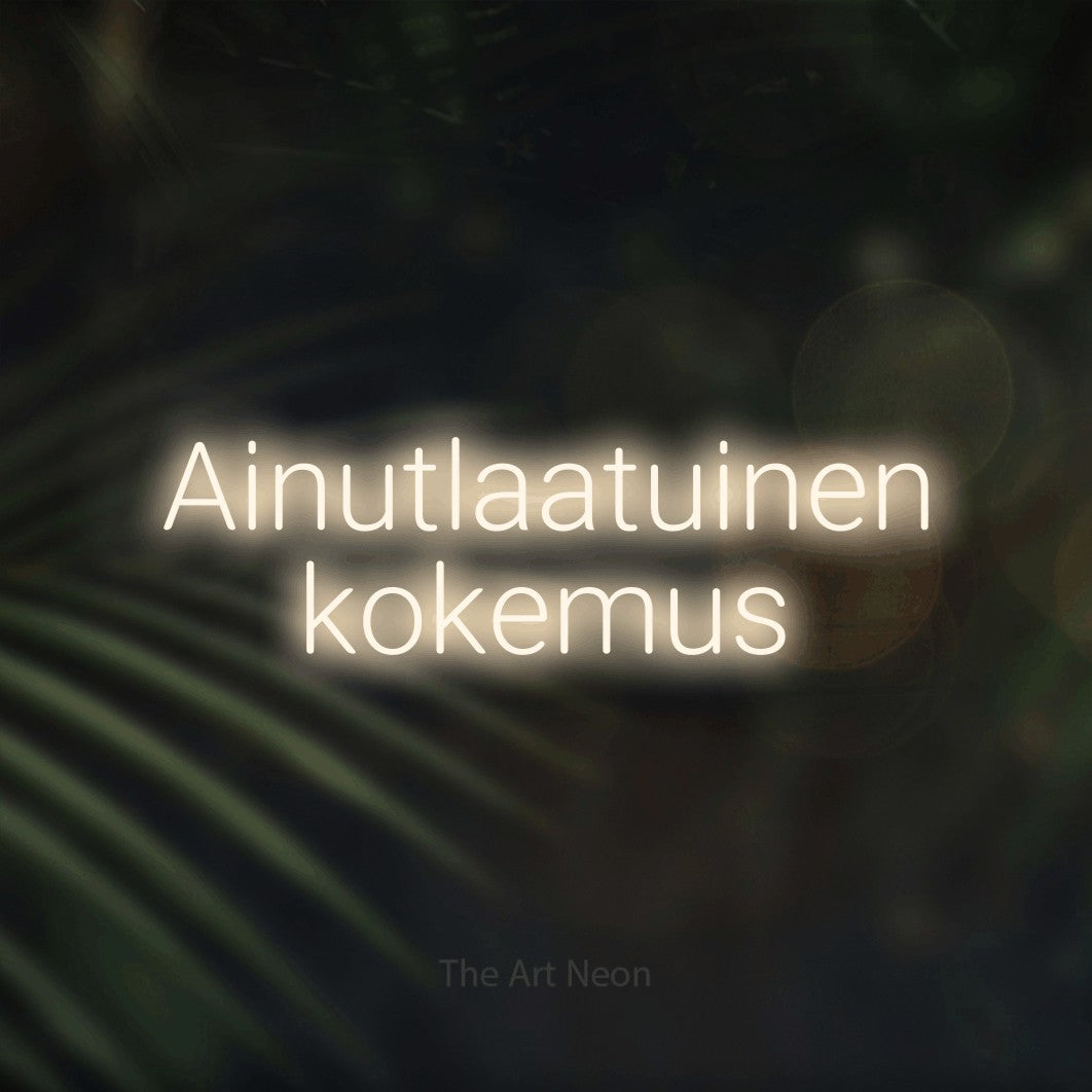 LED neon sign reading “Ainutlaatuinen kokemus”, arranged in 2 lines.