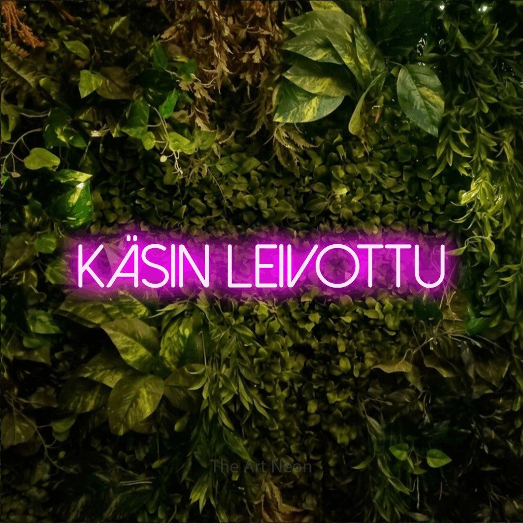 LED neon sign reading “käsin leivottu”, arranged in a single line.
