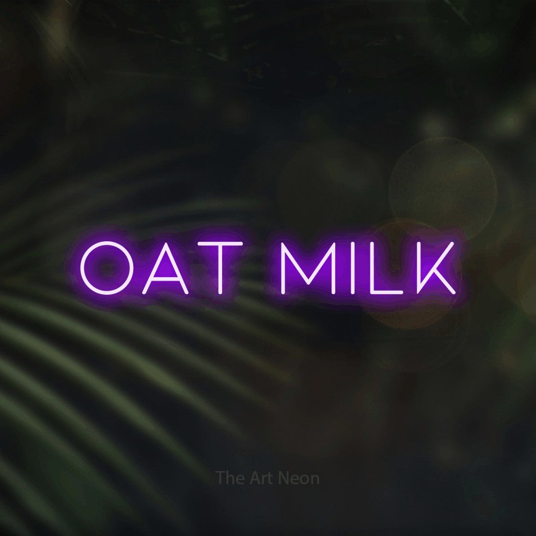 LED neon sign reading “Oat milk”, arranged in a single line.
