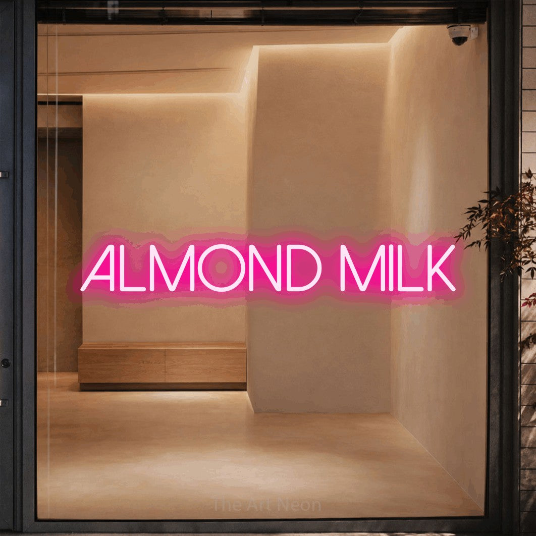 LED neon sign reading “Almond milk”, arranged in a single line.
