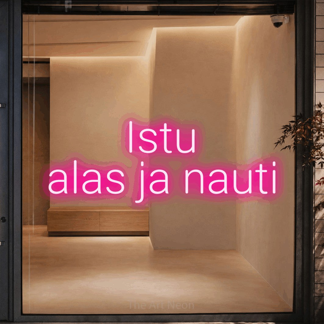 LED neon sign reading “Istu alas ja nauti”, arranged in 2 lines.