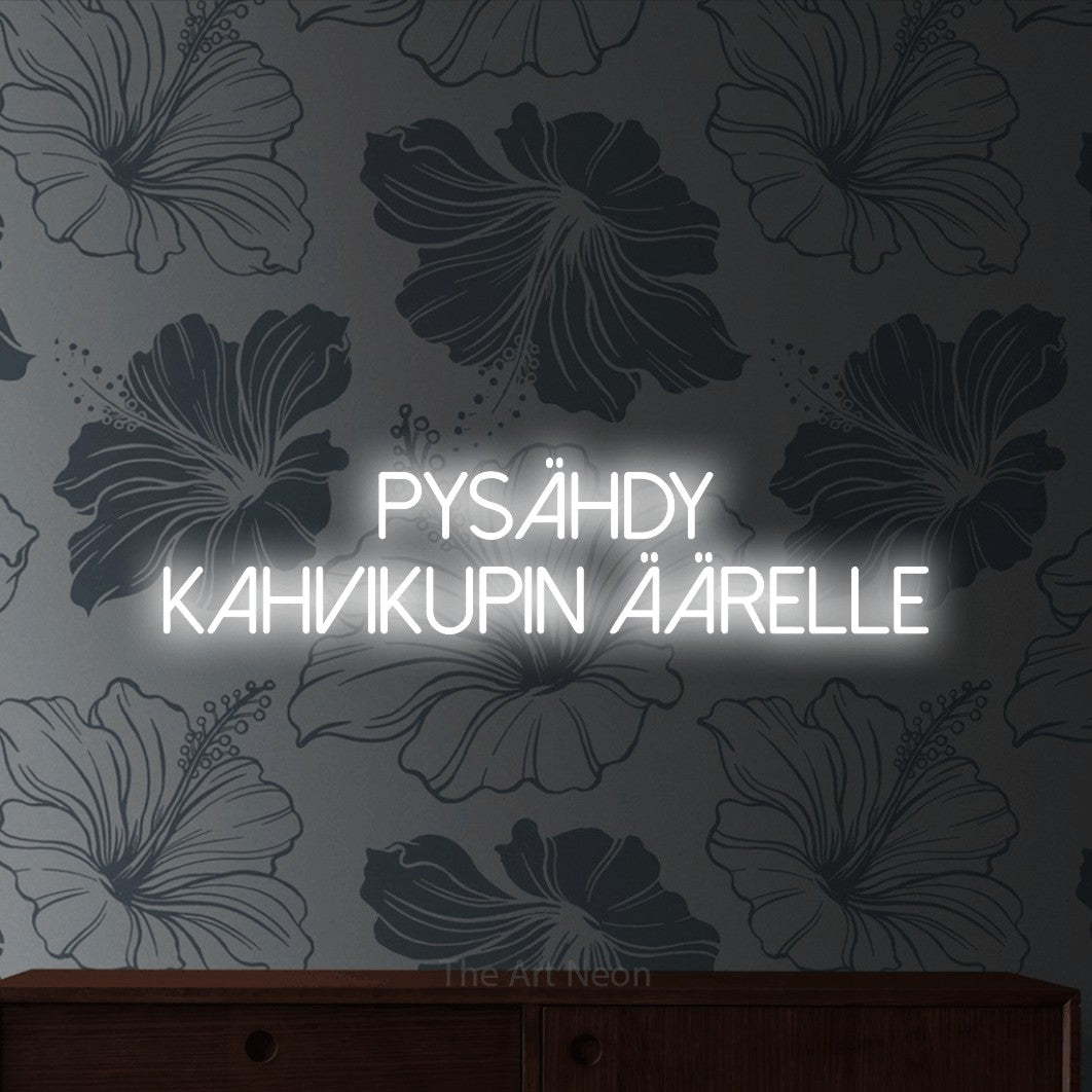 LED neon sign reading “pysähdy kahvikupin äärelle”, arranged in 2 lines.